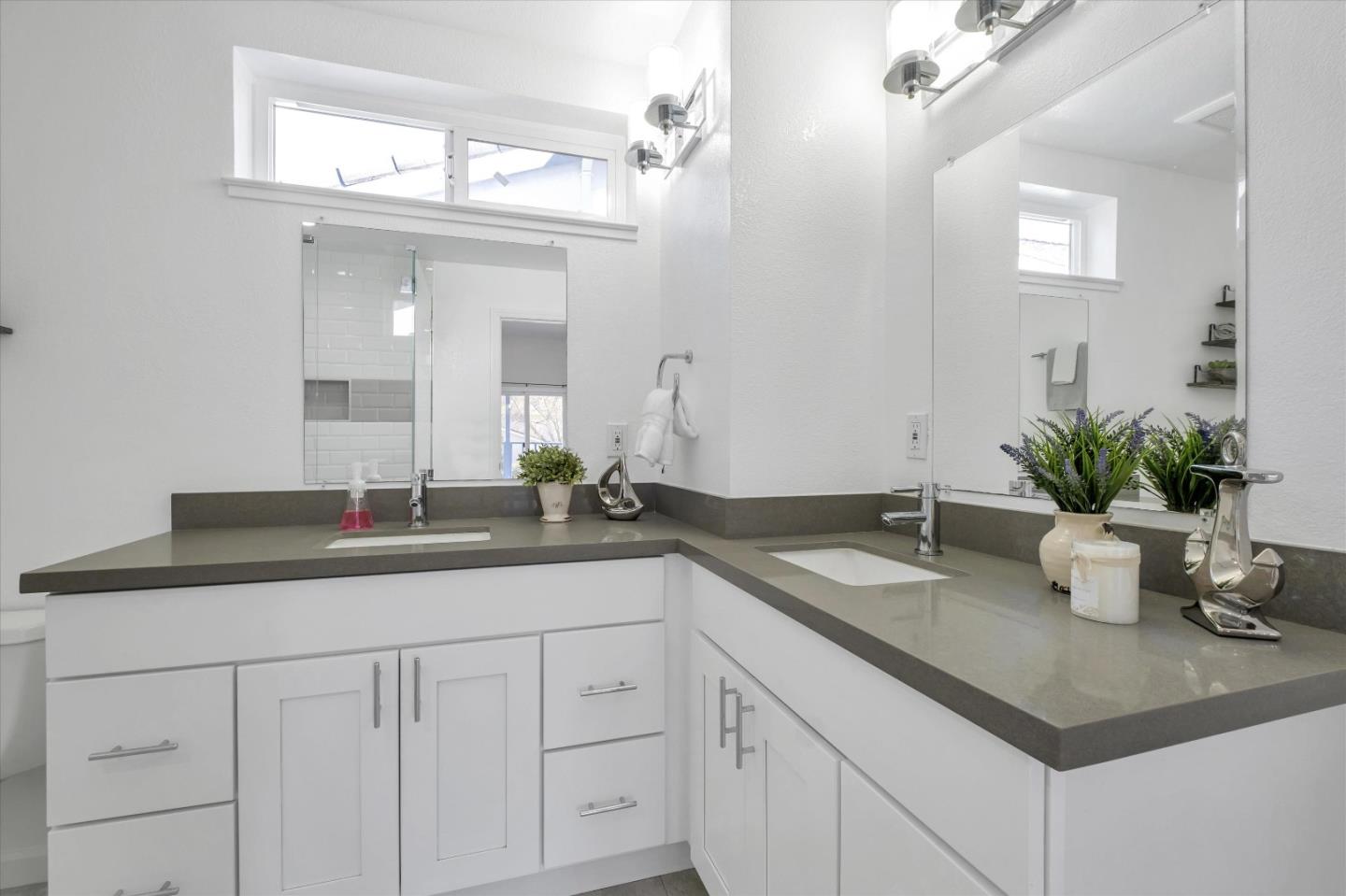 36286 Salisbury Drive Newark, CA 94560 - Photo 24 of 30 a bathroom with a granite countertop sink a mirror and a white