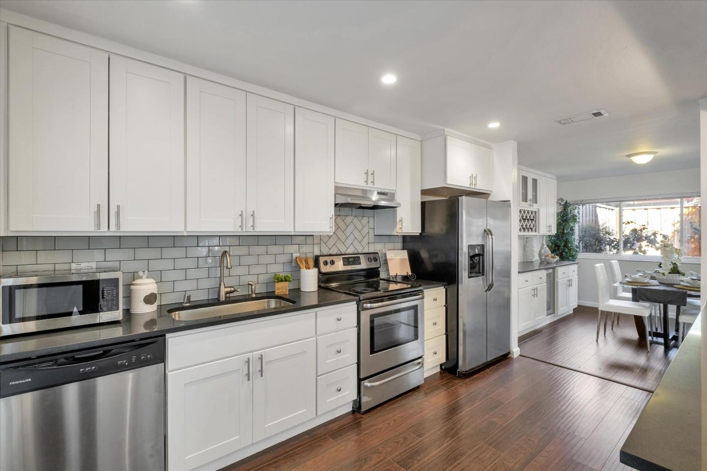 36286 Salisbury Drive Newark, CA 94560 - Photo 5 of 30 a kitchen with stainless steel appliances a refrigerator sink and microwave