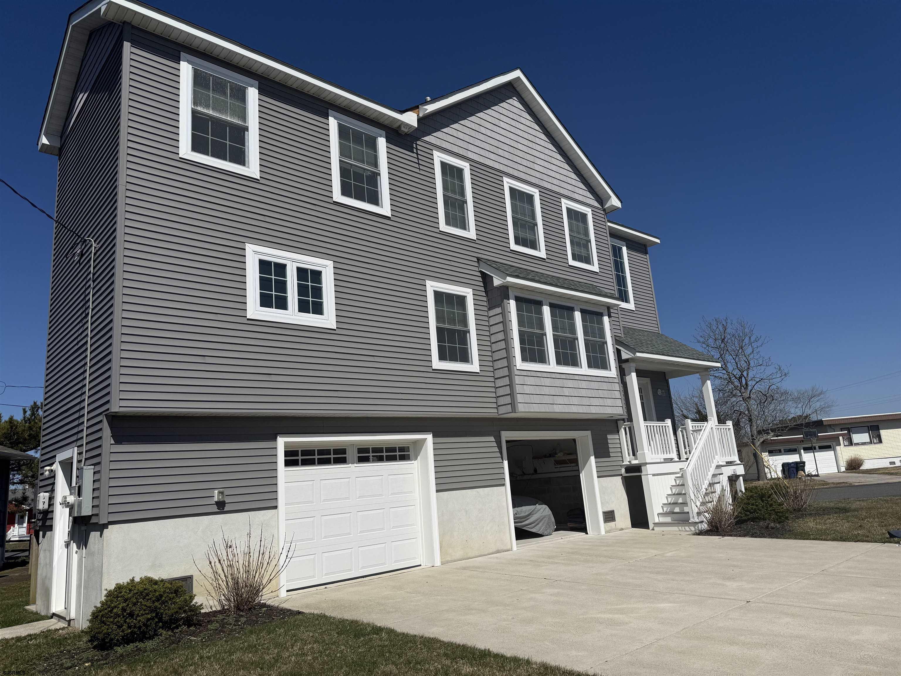 101 West Beach Avenue Brigantine, NJ 08203 - Photo 1 of 11 a front view of a house with a yard