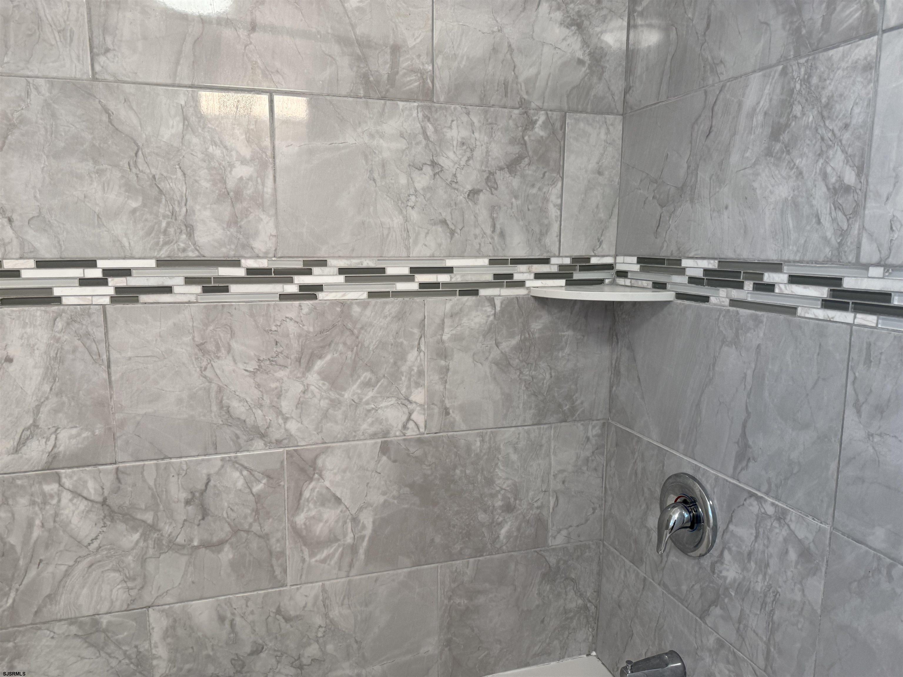 101 West Beach Avenue Brigantine, NJ 08203 - Photo 7 of 11 a close view of a shower in a bathroom