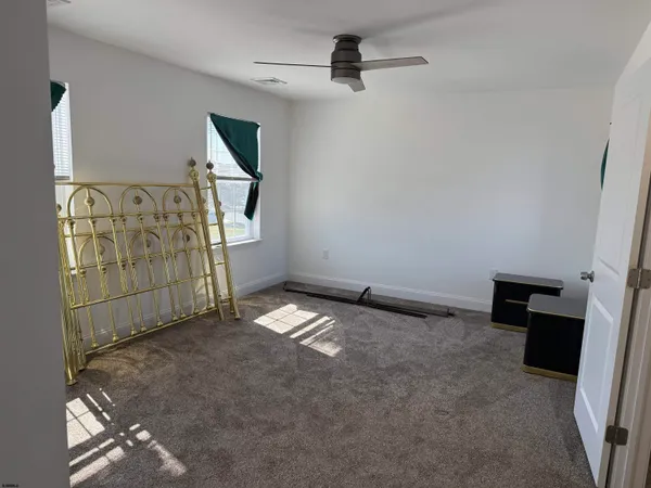 a view of empty room with fireplace