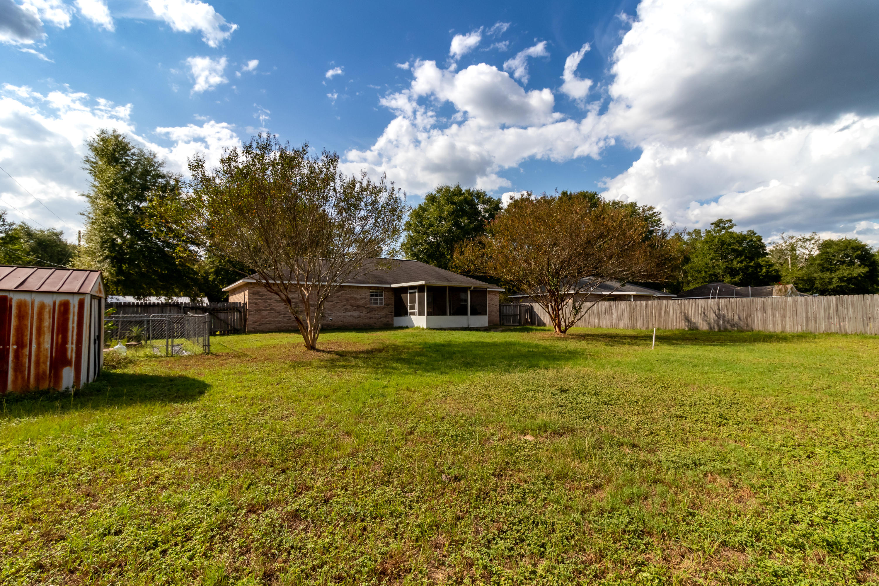 6215 Winstead Road Crestview, FL 32539 - Photo 2 of 11 a view of a house with a yard
