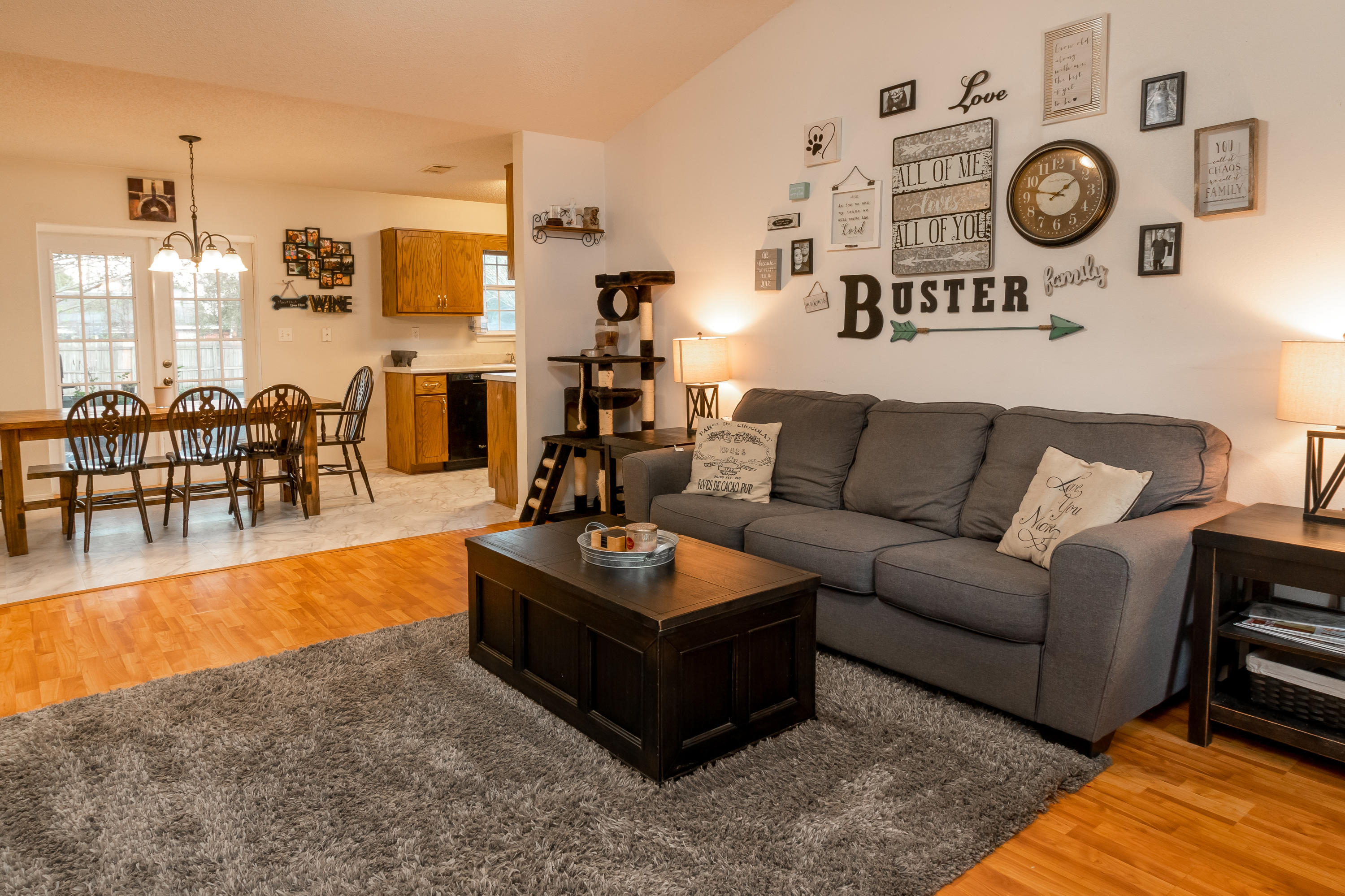 6215 Winstead Road Crestview, FL 32539 - Photo 3 of 11 a living room with furniture a rug and white walls