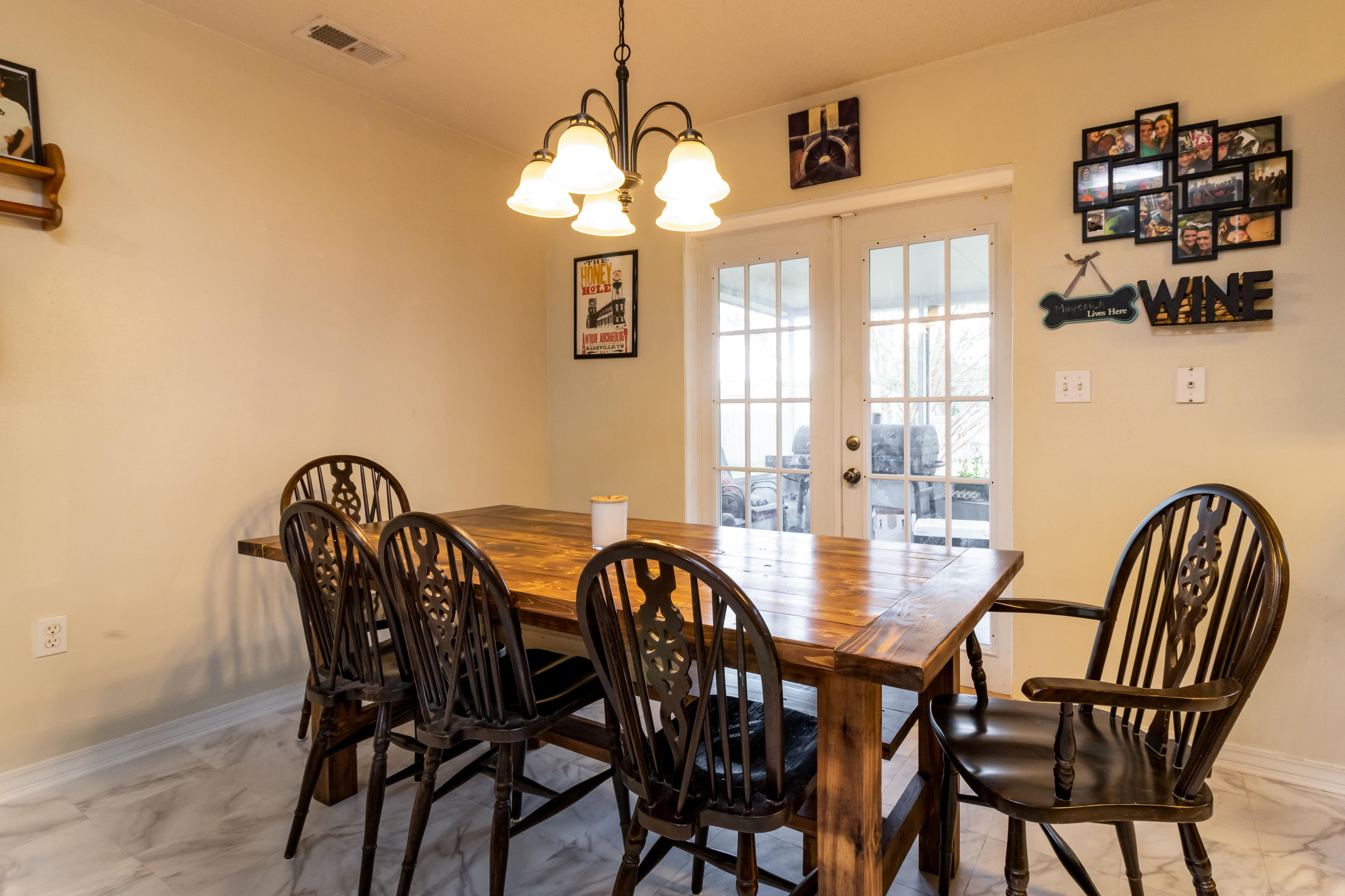 6215 Winstead Road Crestview, FL 32539 - Photo 5 of 11 a view of a dining room with furniture and chandelier