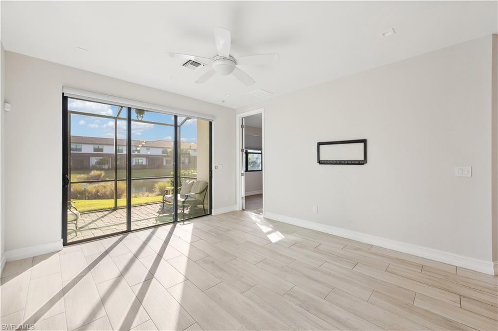 7640 Morgan Way Naples, FL 34119 - Photo 6 of 12 a view of an empty room with a window