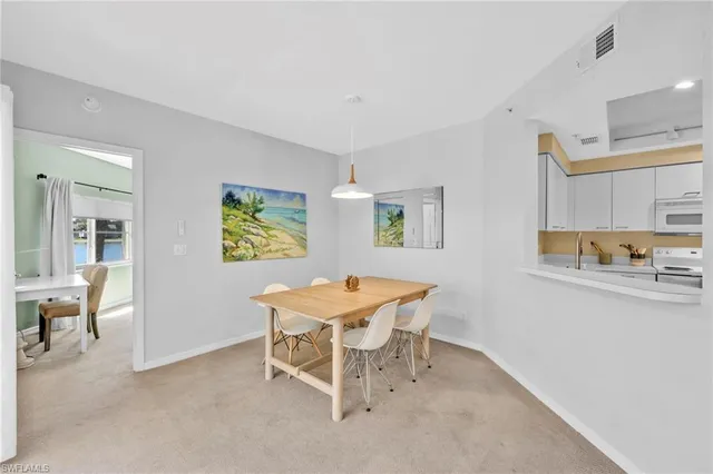 a view of a dining room with furniture