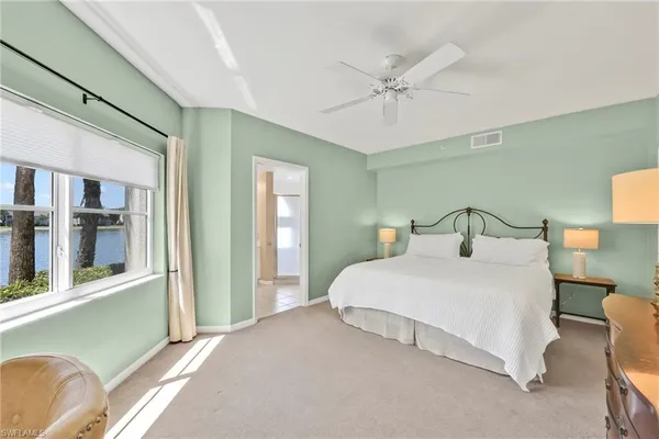 a bedroom with a bed and with cabinets