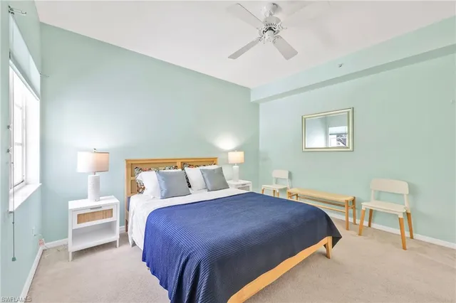 a bedroom with a bed and a chair