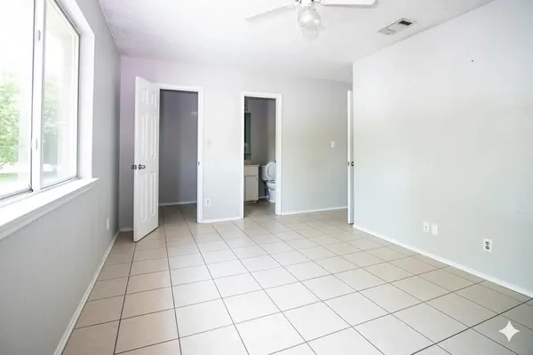 a view of an empty room and window