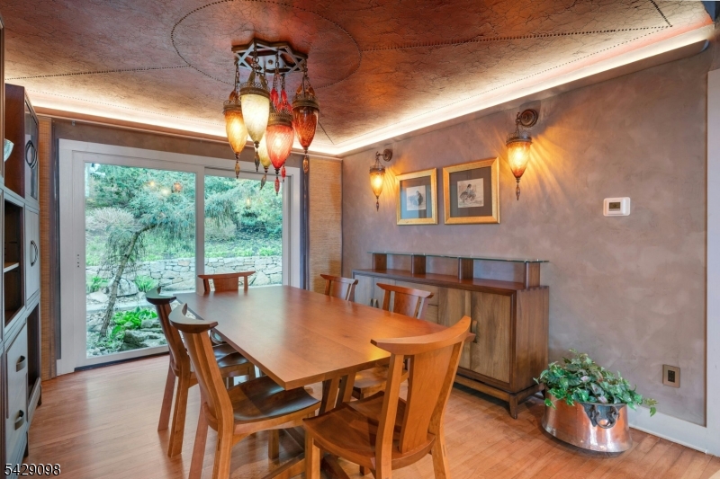 174 Bliss Road Mendham, NJ 07945 - Photo 12 of 49 a view of a dining room with furniture window and wooden floor