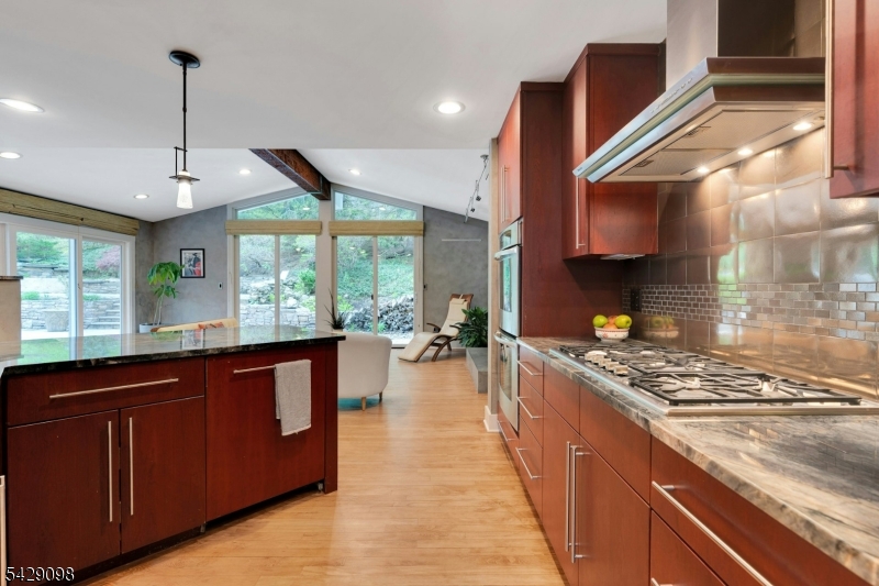 174 Bliss Road Mendham, NJ 07945 - Photo 21 of 49 a kitchen with stainless steel appliances granite countertop a stove a sink and a wooden floors