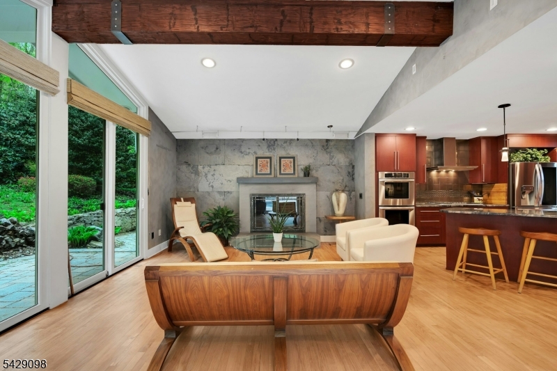 174 Bliss Road Mendham, NJ 07945 - Photo 24 of 49 a living room with fireplace furniture and a large window