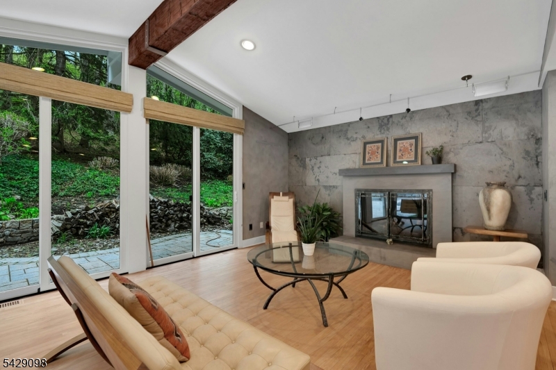 174 Bliss Road Mendham, NJ 07945 - Photo 29 of 49 a living room with furniture and a fireplace