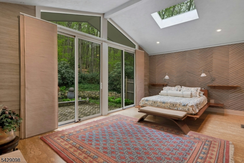 174 Bliss Road Mendham, NJ 07945 - Photo 31 of 49 a bedroom with a large bed and a large window