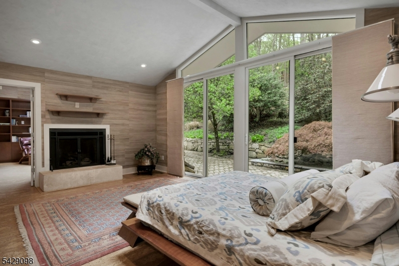 174 Bliss Road Mendham, NJ 07945 - Photo 32 of 49 a bed sitting in a spacious bedroom next to a window