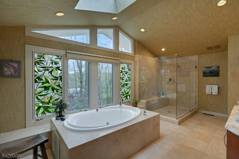 174 Bliss Road Mendham, NJ 07945 - Photo 34 of 49 a bathroom with a bathtub and a shower