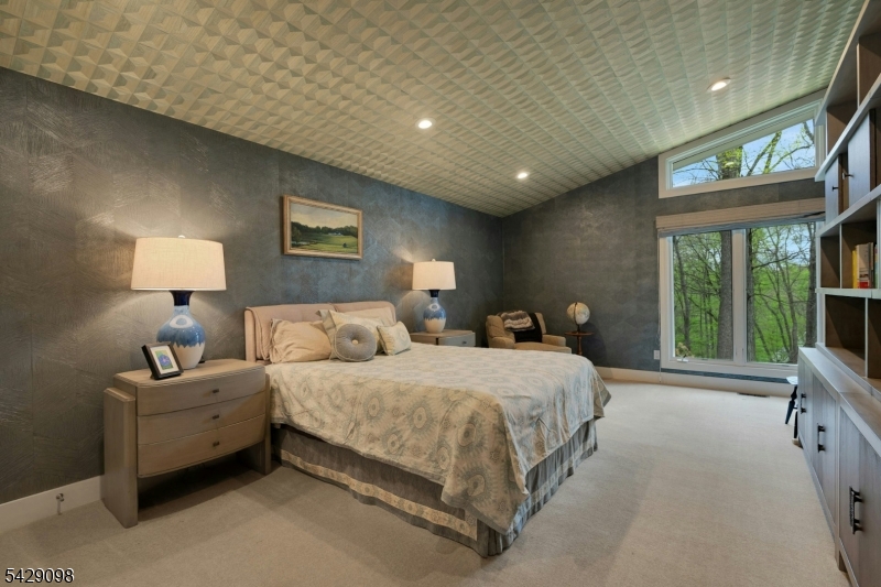 174 Bliss Road Mendham, NJ 07945 - Photo 39 of 49 a spacious bedroom with a bed and a large window