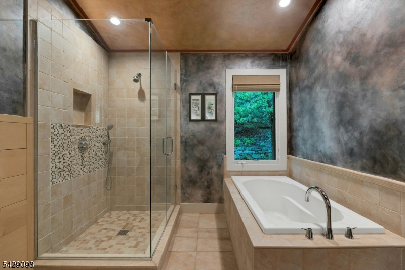 174 Bliss Road Mendham, NJ 07945 - Photo 44 of 49 a bathroom with a tub shower and window