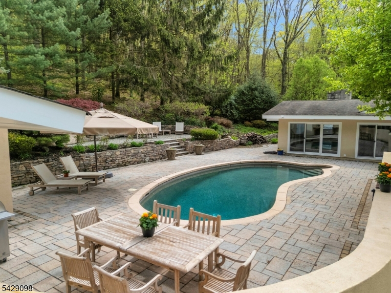 174 Bliss Road Mendham, NJ 07945 - Photo 5 of 49 an outdoor space with furniture and garden