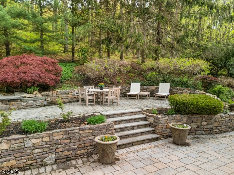 174 Bliss Road Mendham, NJ 07945 - Photo 7 of 49 a view of a backyard with sitting area