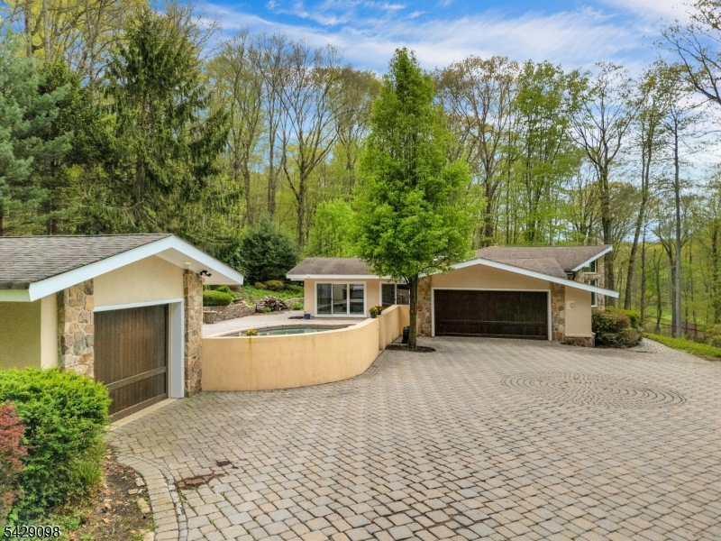 174 Bliss Road Mendham, NJ 07945 - Photo 9 of 49 front view of house with a yard and trees