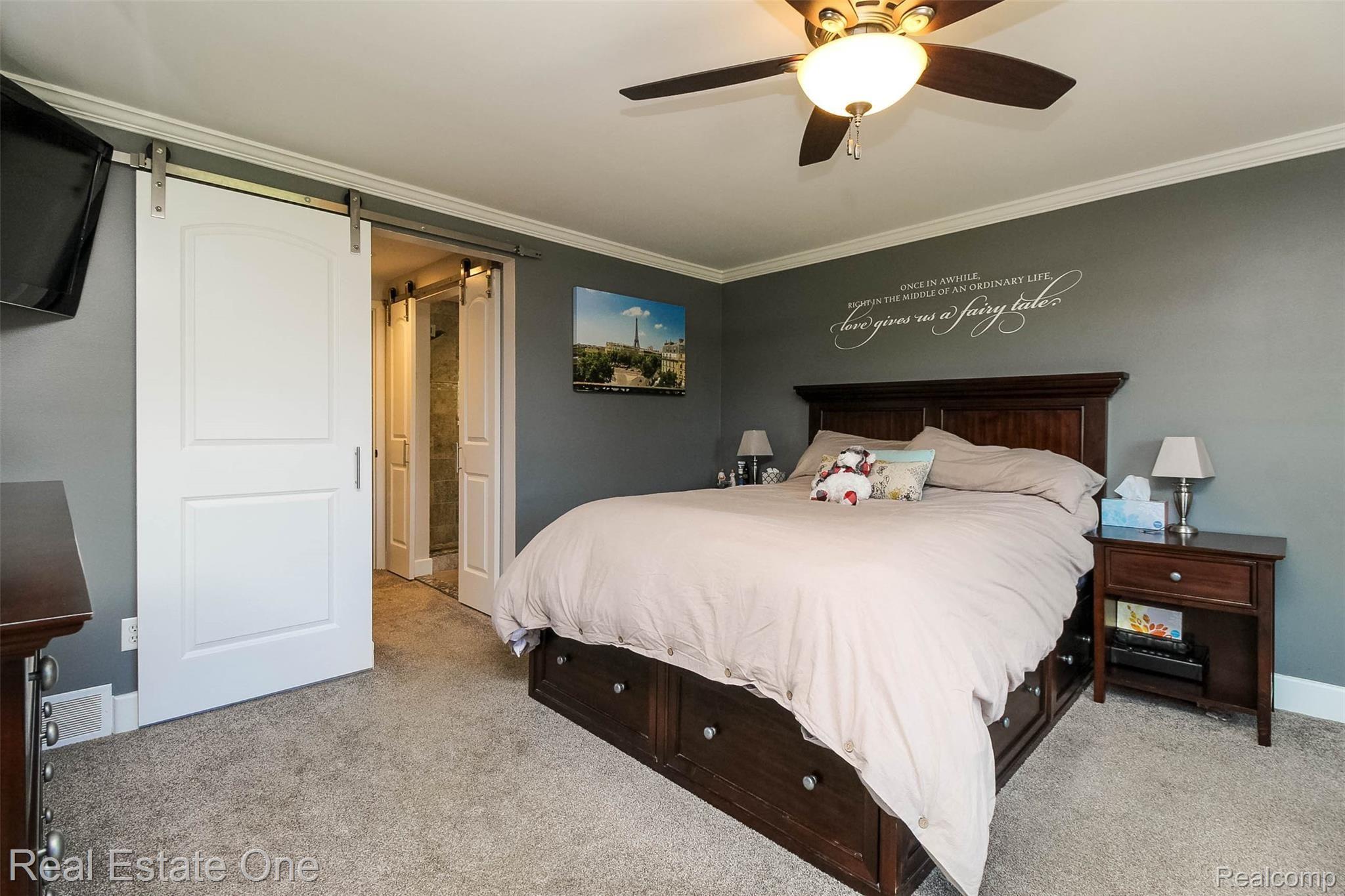 475 Grace Avenue Rochester, MI 48307 - Photo 17 of 58 Sliding barn door leads to custom built closet and bathroom