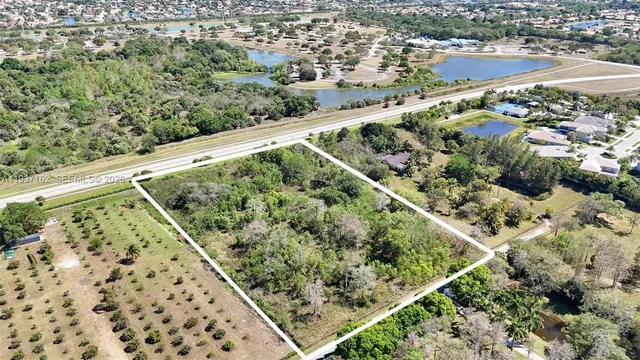 an aerial view of a yard and mountain