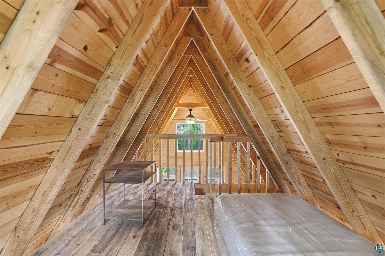 5298 Long Island Tower, MN 55790 - Photo 20 of 31 Vaulted A-frame ceiling with natural wood planking and exposed beams