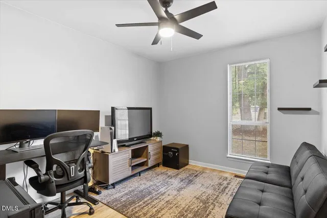 a bedroom with a workspace