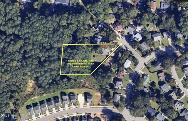 front view of a house with a tree