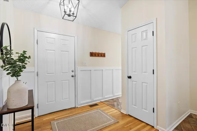 a view of an entryway with wooden floor