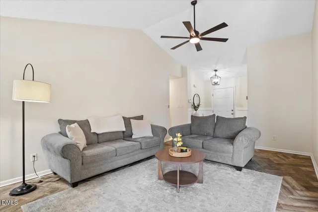 a living room with furniture and a rug