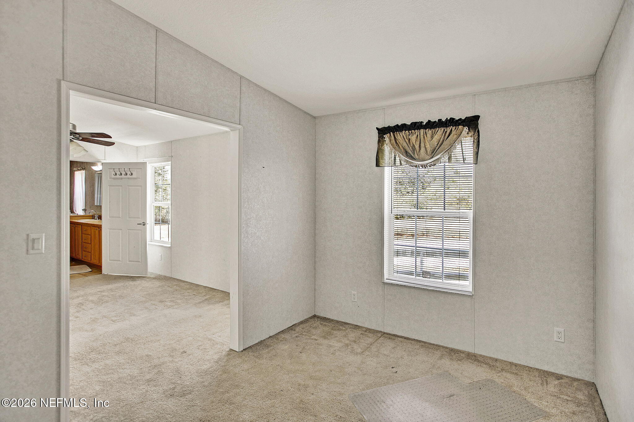 5891 Sequoia Road Keystone Heights, FL 32656 - Photo 11 of 29 an empty room with windows