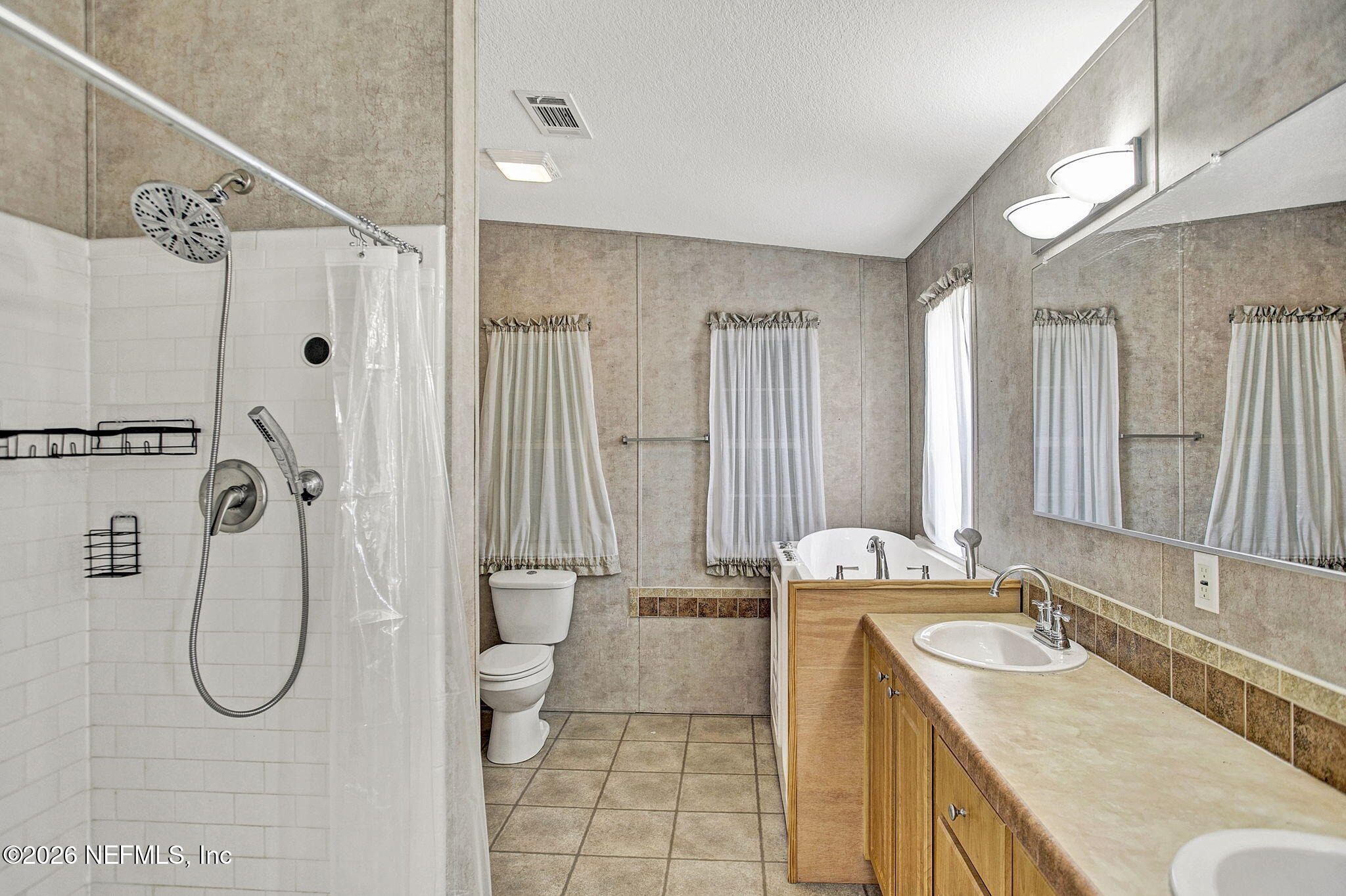 5891 Sequoia Road Keystone Heights, FL 32656 - Photo 14 of 29 a bathroom with a granite countertop sink a toilet and shower