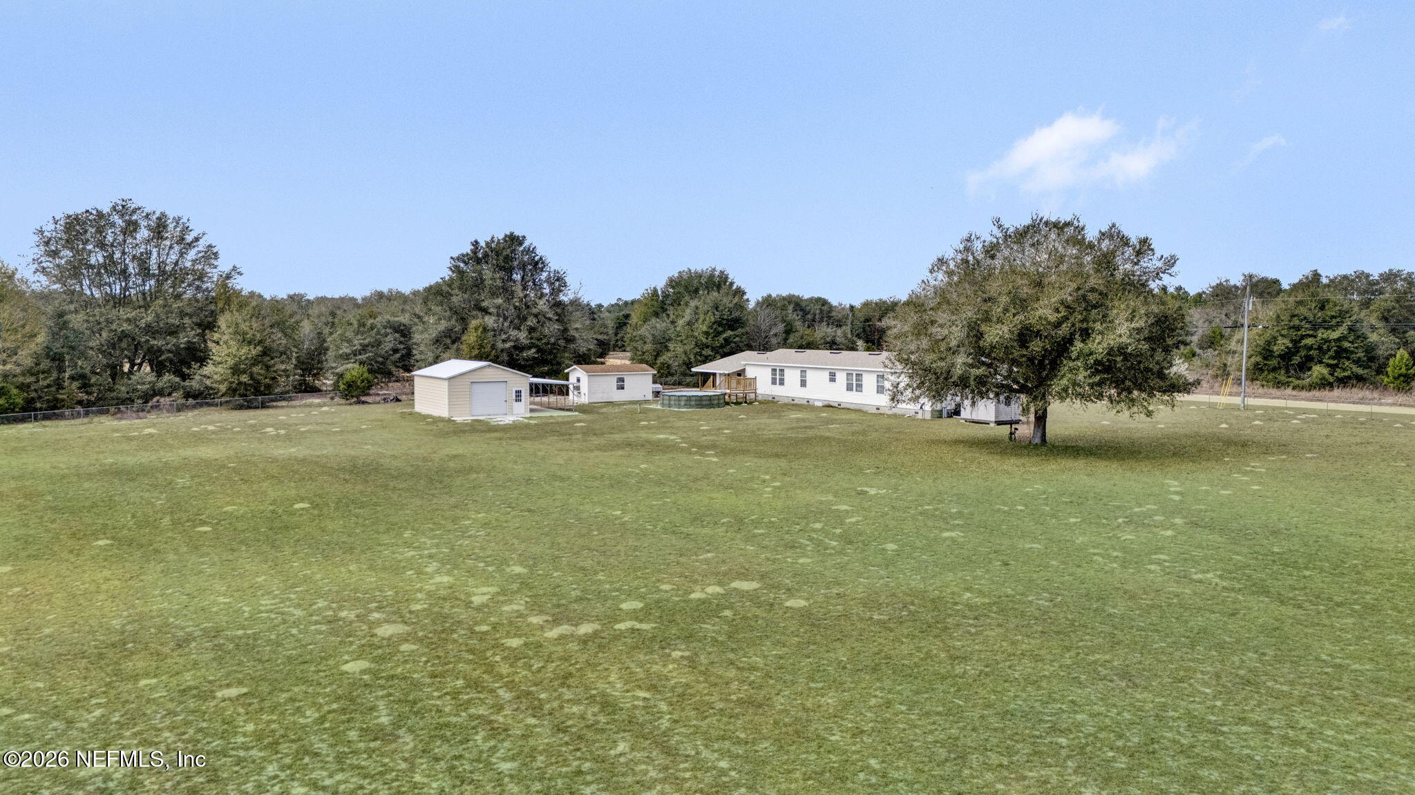 5891 Sequoia Road Keystone Heights, FL 32656 - Photo 17 of 29 a view of a lake with a big yard