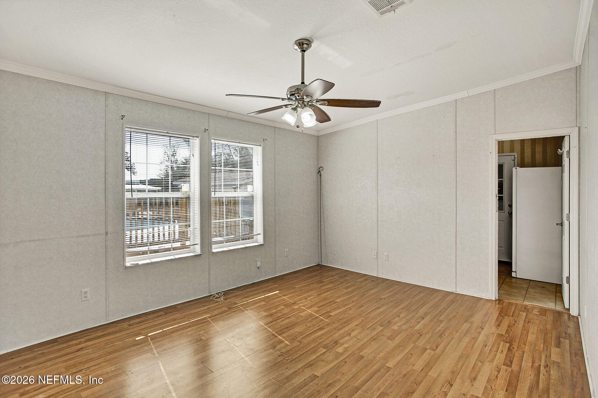 5891 Sequoia Road Keystone Heights, FL 32656 - Photo 18 of 29 a view of empty room with wooden floor and fan