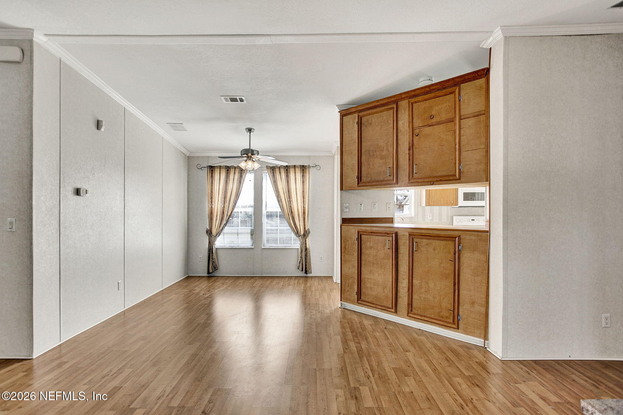 5891 Sequoia Road Keystone Heights, FL 32656 - Photo 3 of 29 a view of kitchen with wooden floor and electronic appliances