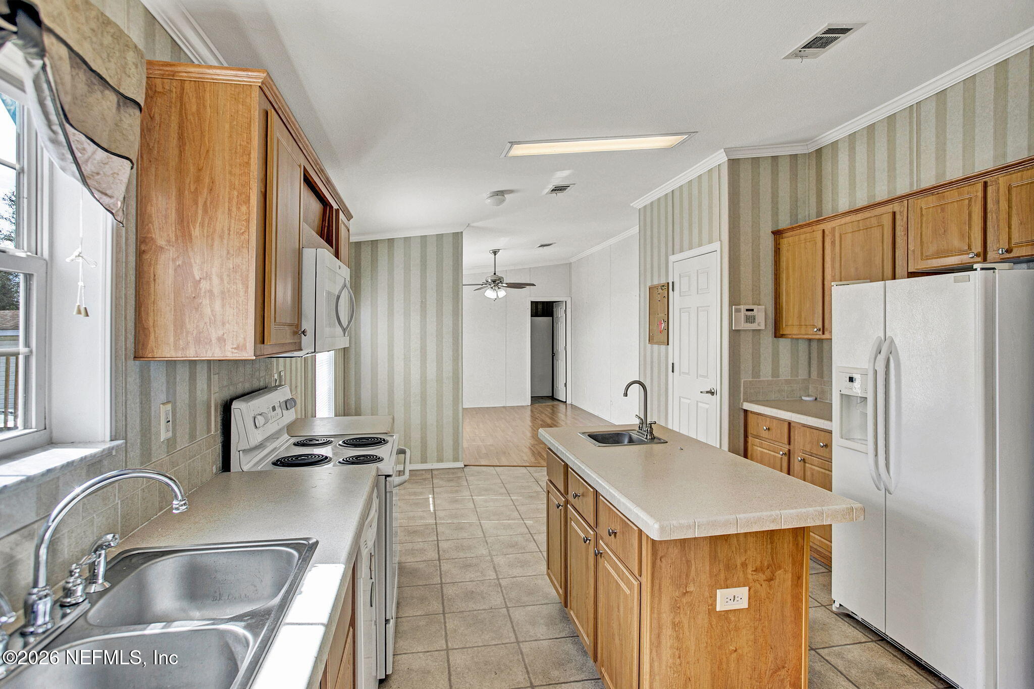 5891 Sequoia Road Keystone Heights, FL 32656 - Photo 5 of 29 a kitchen with stainless steel appliances granite countertop a sink stove and refrigerator