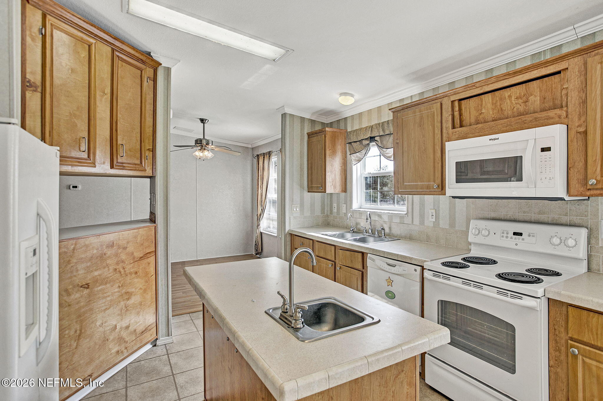 5891 Sequoia Road Keystone Heights, FL 32656 - Photo 6 of 29 a kitchen with stainless steel appliances granite countertop a sink stove and refrigerator