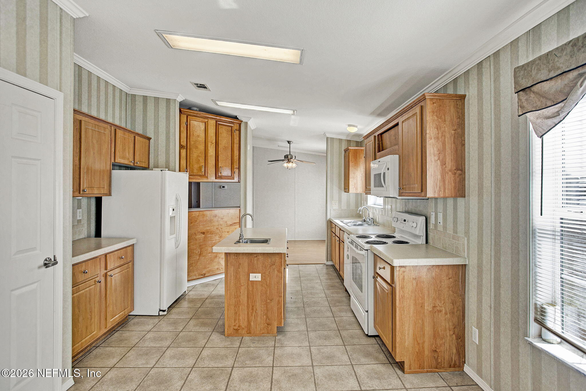 5891 Sequoia Road Keystone Heights, FL 32656 - Photo 7 of 29 a kitchen with stainless steel appliances granite countertop a refrigerator and a stove top oven