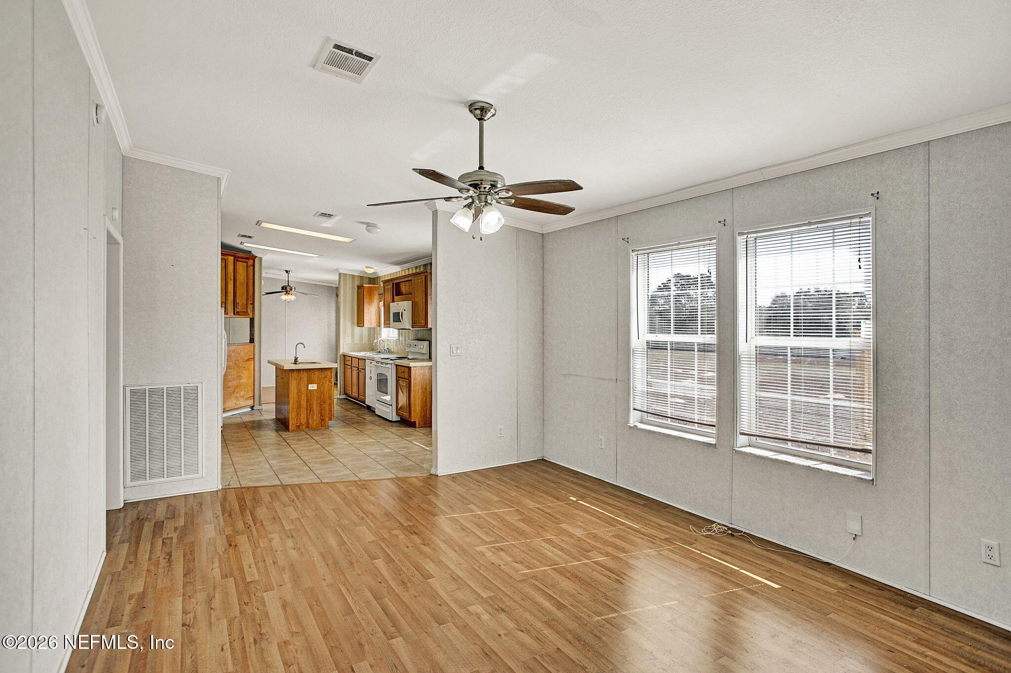 5891 Sequoia Road Keystone Heights, FL 32656 - Photo 8 of 29 a view of a livingroom with a furniture wooden floor and a window