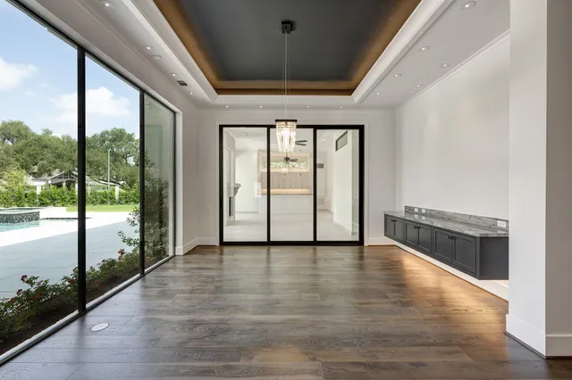 a large bathroom with double vanity sinks a large mirror and a bathtub