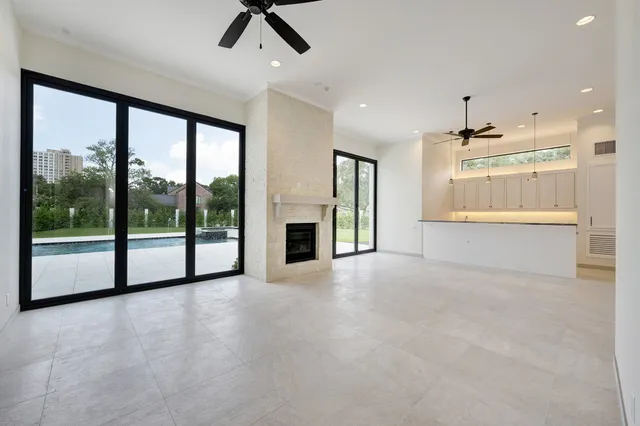a kitchen with kitchen island a counter top space and stainless steel appliances