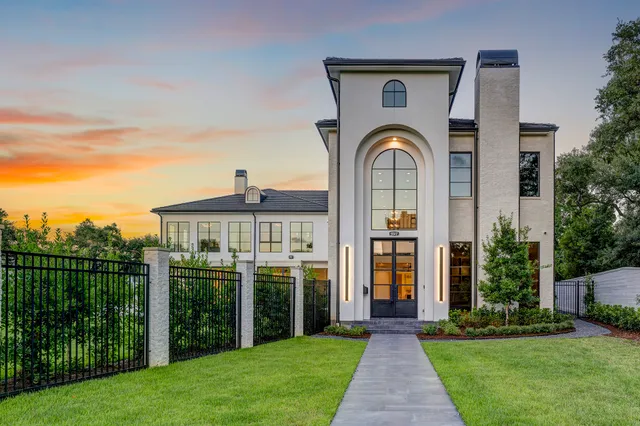 a bathroom with a granite countertop sink a toilet and a mirror