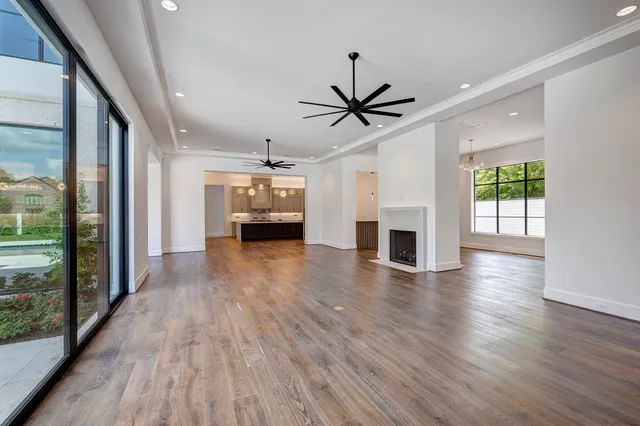 a view of a livingroom with an empty space and a fireplace