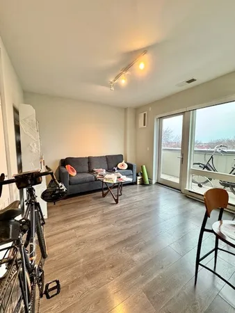 a view of a kitchen with microwave and furniture