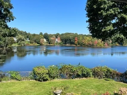 an aerial view of a houses with lake view