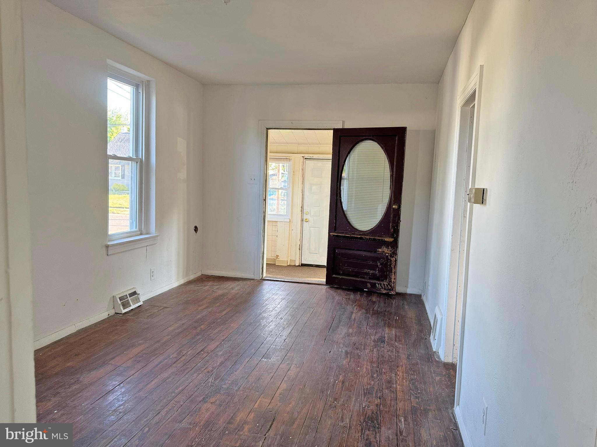 524 8th Avenue Lindenwold, NJ 08021 - Photo 6 of 19 an empty room with wooden floor and window