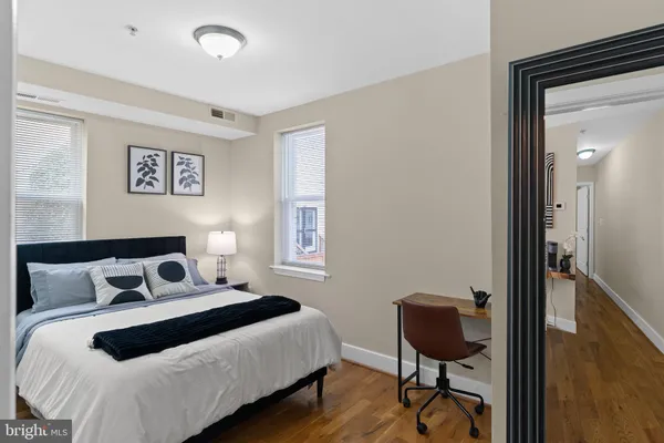 a bedroom with a bed and a chair