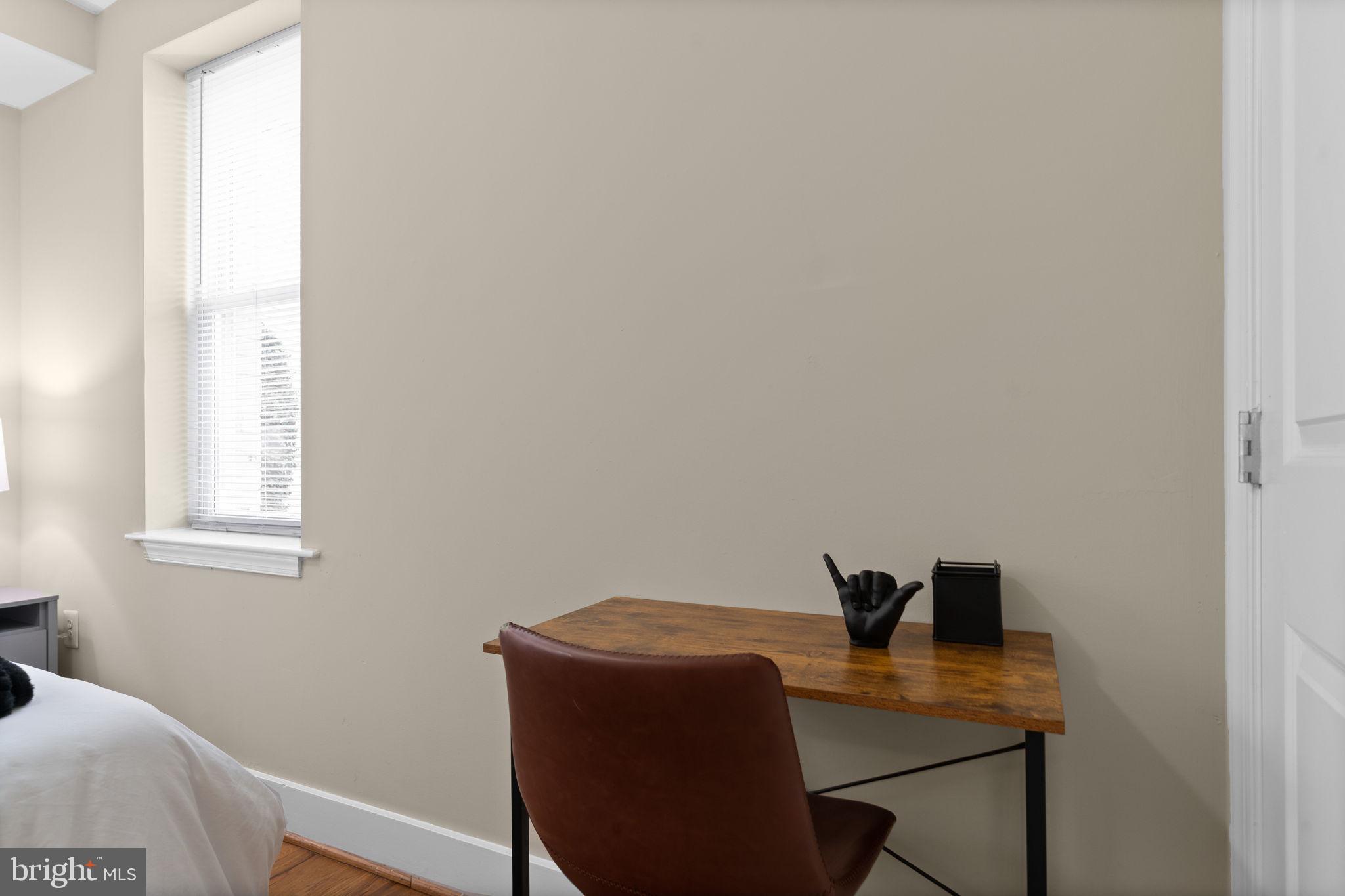 417 18th Street Northeast, Unit 103 Washington, DC 20002 - Photo 20 of 40 a view of a workspace with furniture and a window